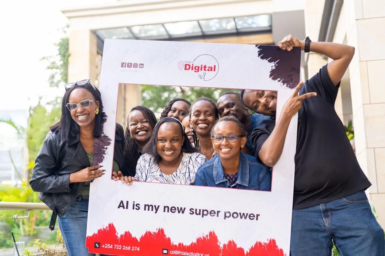 Community members holding the This Is Digital "AI is my new super power" frame outside a Nairobi venue